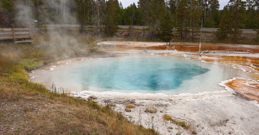 A 'typical' emerald pool. Crystal blue boiling water with mineral and algae surround.