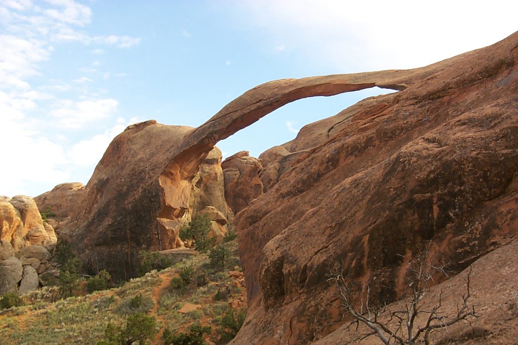 A shot from further up the trail looking back toward the Landscape Arch. You can see the how thin and long this arch is and you can also see where some of the arch has (geologically) recently broken away to make it so thin.