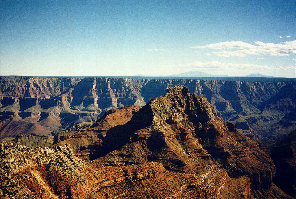 This is a view south from the North Rim. In the distance is the South Rim, and further distant on the horizon, the San Francisco Mountains.