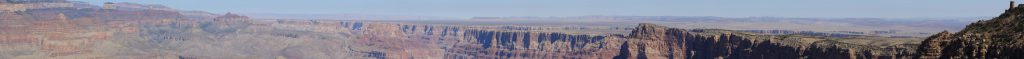 A Panorama from Navajo Point. This shot shows the north rim on the left, Wotan's Throne, Vishnu's Temple, Jupiter Temple, the Colorado and Little Colorado canyons, the anticline to the painted desert, and on the very right, the Desert View watch tower.