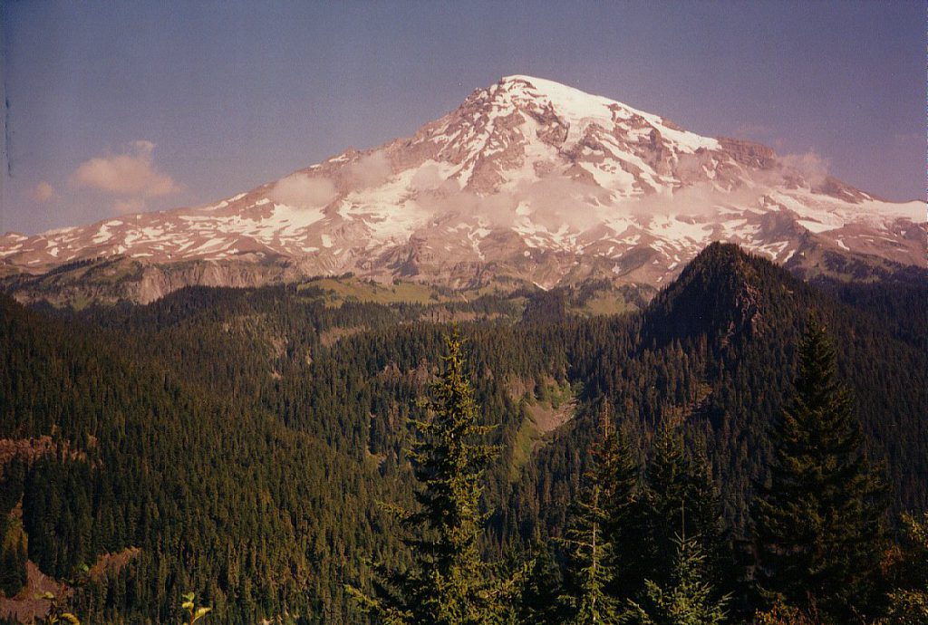 Here is a view of Mount Rainier taken from a switch-back on the road to Paradise. Note the belt of clouds! Our target hike was to climb the Nisqually moraine as far as we could get round-trip in one day.